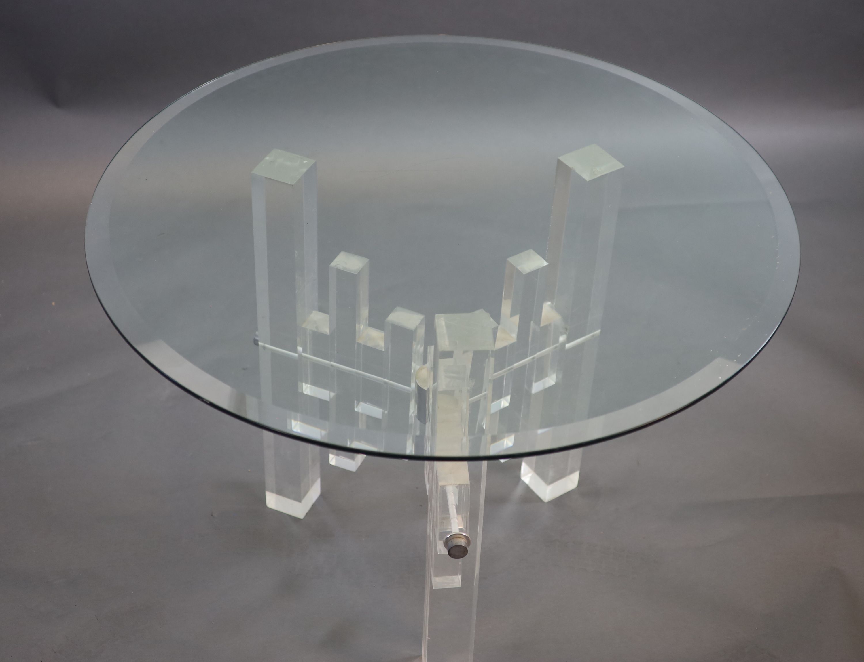 A 1970's German glass top table 107cm diameter, 76cm high.